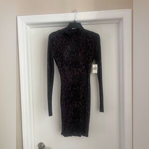 GUESS size small high neck, open back, long sleeve black leopard mini dress